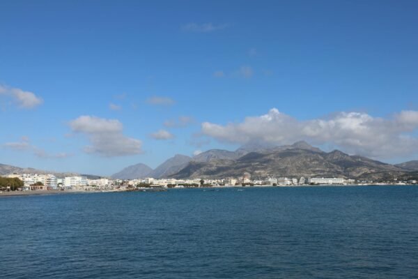 city under mountains and by sea