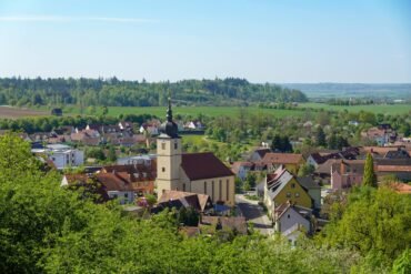 scenic view of quaint village with church